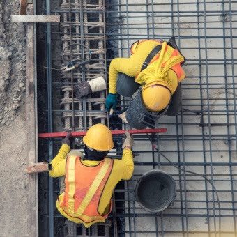 Two Engineers working on site in PPE